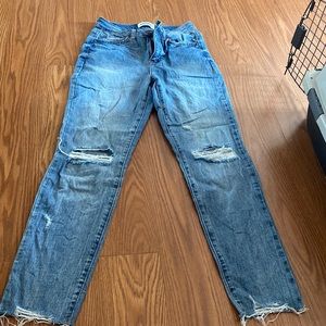 Blue jeans, two rips at knees